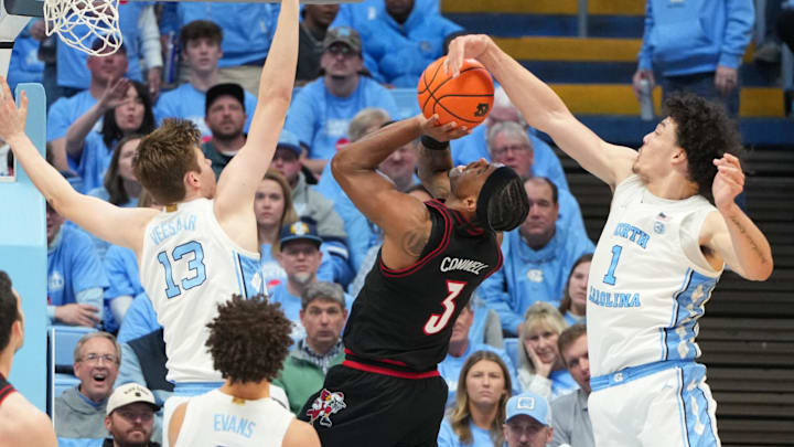 Feb 23, 2026; Chapel Hill, North Carolina, USA; Louisville Cardinals guard Ryan Conwell (3) shoots as North Carolina Tar Heels center Henri Veesaar (13) and forward Zayden High (1) defend in the second half at Dean E. Smith Center. Mandatory Credit: Bob Donnan-Imagn Images Feb 23, 2026; Chapel Hill, North Carolina, USA; Louisville Cardinals guard Ryan Conwell (3) shoots as North Carolina Tar Heels center Henri Veesaar (13) and forward Zayden High (1) defend in the second half at Dean E. Smith Center. Mandatory Credit: Bob Donnan-Imagn Images