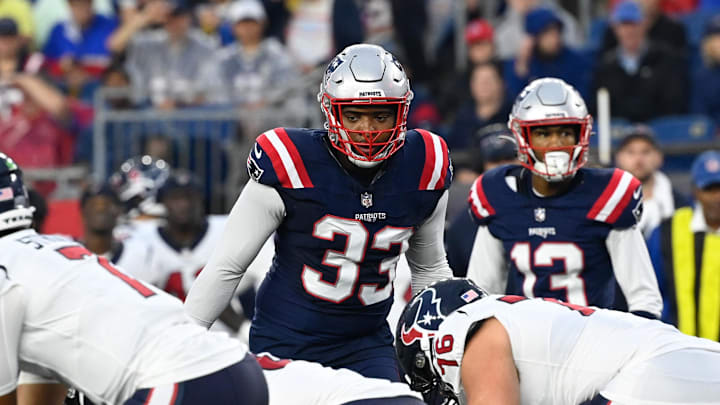 Aug 10, 2023; Foxborough, Massachusetts, USA; New England Patriots linebacker Anfernee Jennings (33) waits on the snap of the ball during the first half against the Houston Texans at Gillette Stadium. Mandatory Credit: Eric Canha-Imagn Images