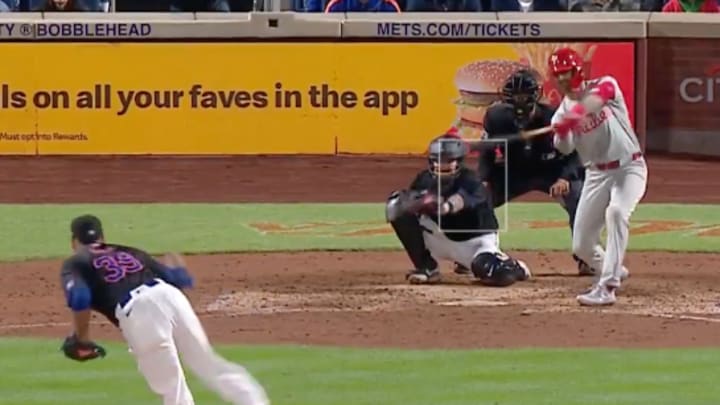 Phillies outfielder Whit Merrifield attempts to check his swing on a pitch by Mets closer Edwin Diaz during the ninth inning of Philadelphia's 5—4 win over New York at Citi Field on Monday night. 