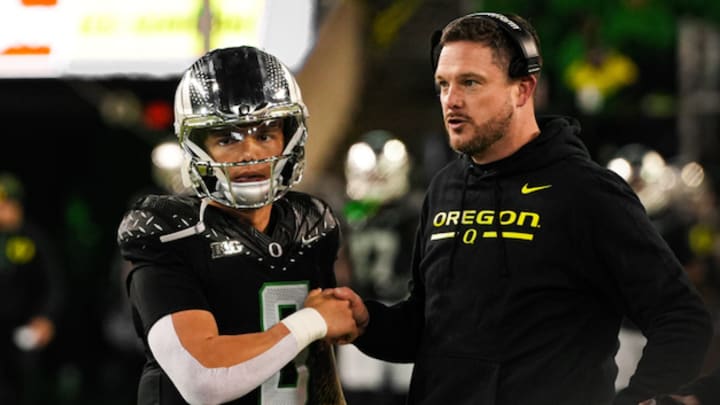 Oregon Ducks quarterback Dillon Gabriel and coach Dan Lanning. Gabriel will set a new FBS record for starts by a quarterback against the Penn State Nittany Lions in the Big Ten Championship Game. 