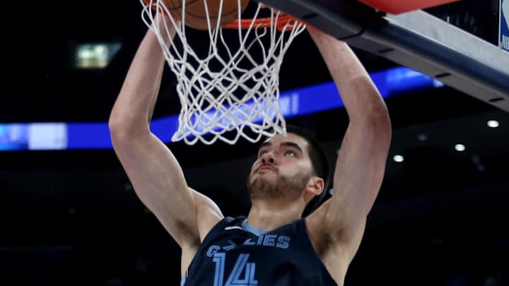 Dec 7, 2025; Memphis, Tennessee, USA; Memphis Grizzlies center Zach Edey (14) dunks during the fourth quarter against the Portland Trail Blazers at FedExForum. Mandatory Credit: Petre Thomas-Imagn Images Dec 7, 2025; Memphis, Tennessee, USA; Memphis Grizzlies center Zach Edey (14) dunks during the fourth quarter against the Portland Trail Blazers at FedExForum. Mandatory Credit: Petre Thomas-Imagn Images