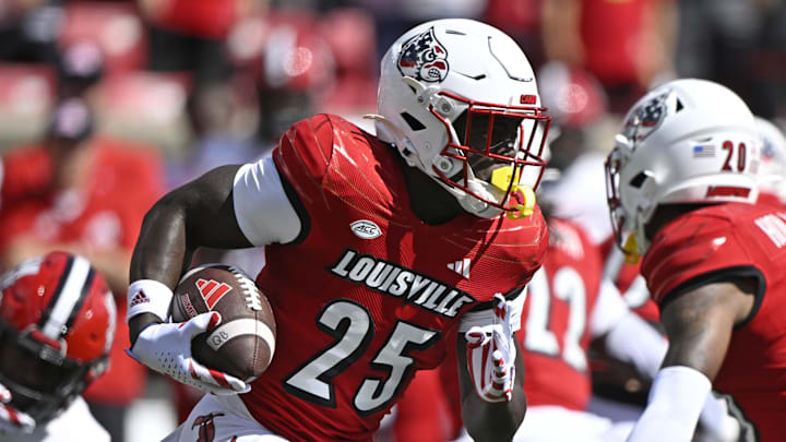 Sep 7, 2024; Louisville, Kentucky, USA; Louisville Cardinals running back Isaac Brown (25) runs the ball against the Jacksonville State Gamecocks during the first quarter at L&N Federal Credit Union Stadium. Sep 7, 2024; Louisville, Kentucky, USA; Louisville Cardinals running back Isaac Brown (25) runs the ball against the Jacksonville State Gamecocks during the first quarter at L&N Federal Credit Union Stadium.