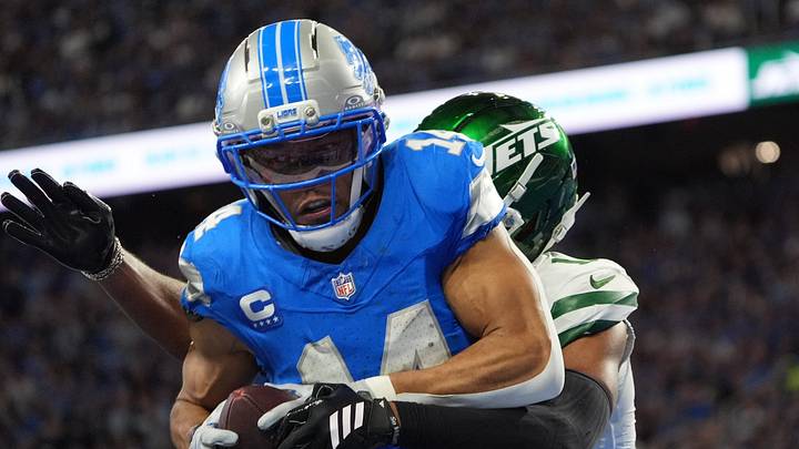 Detroit Lions wide receiver Amon-Ra St. Brown (14) catches the ball for a touchdown during the first half against Jets Detroit Lions wide receiver Amon-Ra St. Brown (14) catches the ball for a touchdown during the first half against Jets