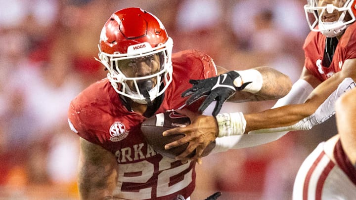 Arkansas Razorbacks running back Ja'Quinden Jackson takes a handoff from quarterback Taylen Green against the Tennessee Volunteers at Razorback Stadium in Fayetteville, Ark.