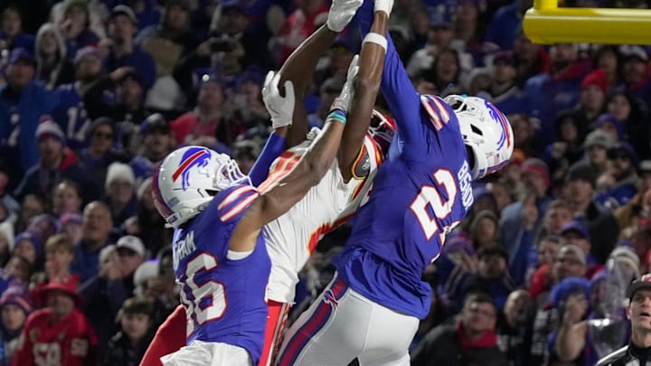 Kansas City Chiefs wide receiver Tyquan Thornton gets the ball swatted away by Buffalo Bills running back Buffalo Bills cornerback Ja'Marcus Ingram and safety Cole Bishop during fourth quarter action against the Kansas City Chiefs at Highmark Stadium in Orchard Park on Nov. 2, 2025.