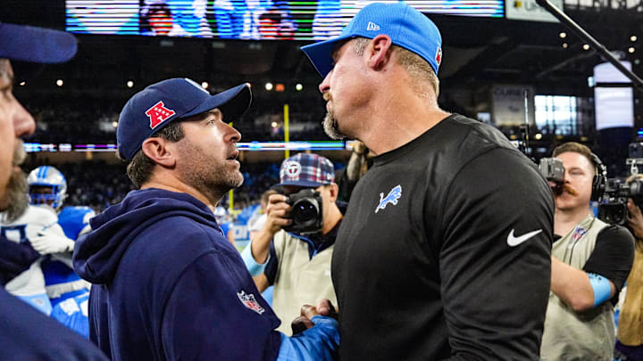 Detroit Lions head coach Dan Campbell shakes hands with Titans coach Brian Callahan