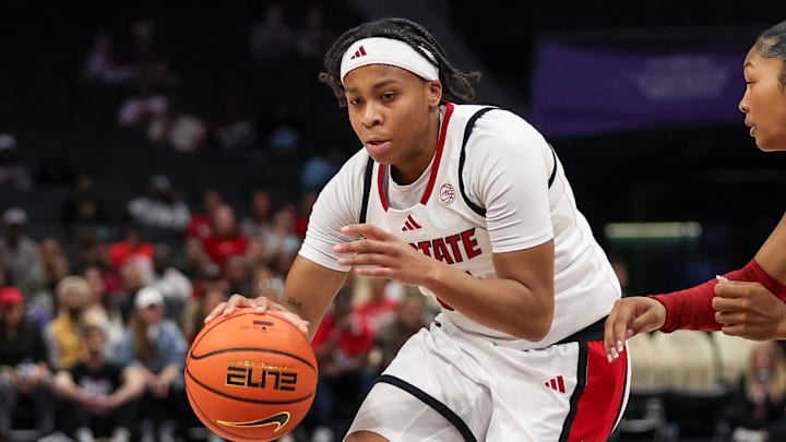 Nov 9, 2025; Charlotte, North Carolina, USA;  NC State Wolfpack guard Zoe Brooks (35) drives the ball against the Southern California Trojans during the second quarter of the Ally Tipoff game at Spectrum Center. Mandatory Credit: Cory Knowlton-Imagn Images
