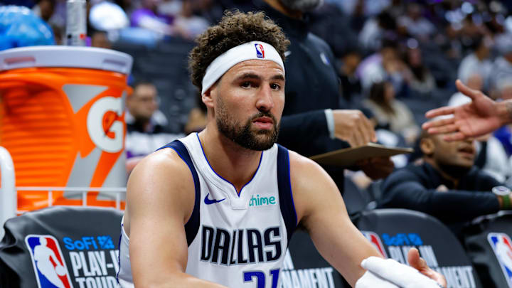 Apr 16, 2025; Sacramento, California, USA; Dallas Mavericks guard Klay Thompson (31) sits on the bench during the fourth quarter against the Sacramento Kings at Golden 1 Center. Mandatory Credit: Sergio Estrada-Imagn Images