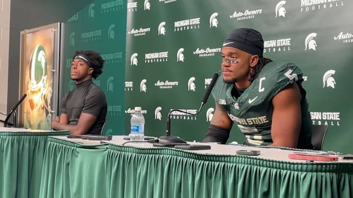 Michigan State quarterback Aidan Chiles (left) and linebacker Jordan Hall (right) speak after a 31-20 loss to Michigan on Oct. 25, 2025. Michigan State quarterback Aidan Chiles (left) and linebacker Jordan Hall (right) speak after a 31-20 loss to Michigan on Oct. 25, 2025.