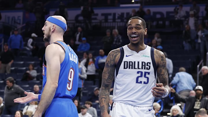 Jan 23, 2025; Oklahoma City, Oklahoma, USA; Dallas Mavericks forward P.J. Washington (25) laughs after a play against Oklahoma City Thunder guard Alex Caruso (9) during the second half at Paycom Center. Mandatory Credit: Alonzo Adams-Imagn Images