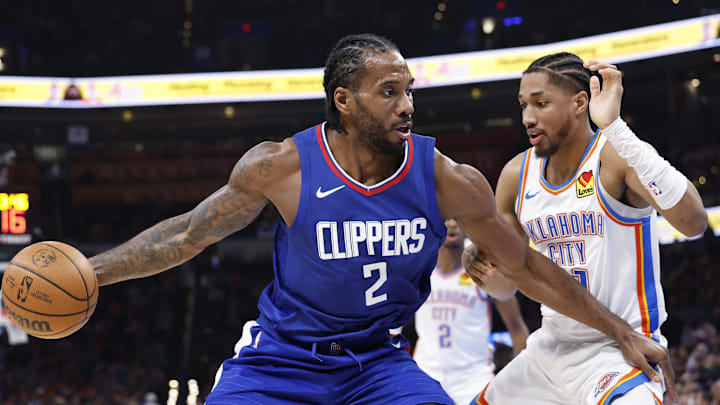 Feb 22, 2024; Oklahoma City, Oklahoma, USA; LA Clippers forward Kawhi Leonard (2) drives to the basket against Oklahoma City Thunder guard Aaron Wiggins (21) during the second half at Paycom Center. Mandatory Credit: Alonzo Adams-Imagn Imagesf
