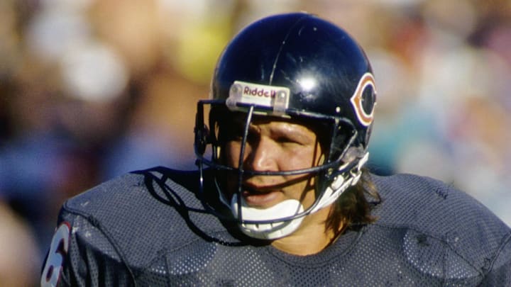 Former Chicago Bears defensive tackle Steve McMichael stands on the field.