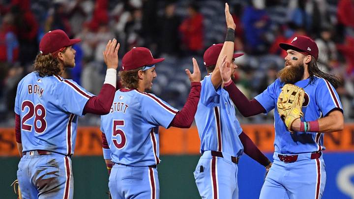 Apr 11, 2024; Philadelphia, Pennsylvania, USA; Philadelphia Phillies outfielder Brandon Marsh (16) high fives third base Alec Bohm (28), second base Bryson Stott (5) and shortstop Trea Turner (7) after win against the Pittsburgh Pirates during the seventh inning at Citizens Bank Park.