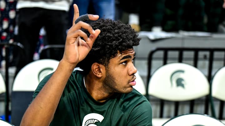 Michigan State's Jase Richardson points to the sky after a moment to himself before the game against Nebraska on Saturday, Dec. 7, 2024, at the Breslin Center in East Lansing.