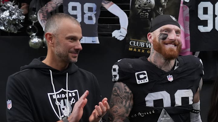 Dec 7, 2025; Paradise, Nevada, USA; Las Vegas Raiders defensive end Maxx Crosby (98) along with his wife Rachel Washburn and daughter Ella Rose Crosby and Raiders general manager John Spytek receives the Walter Payton Man of the Year Award prior to a game against the Denver Broncos at Allegiant Stadium. Mandatory Credit: Kirby Lee-Imagn Images Dec 7, 2025; Paradise, Nevada, USA; Las Vegas Raiders defensive end Maxx Crosby (98) along with his wife Rachel Washburn and daughter Ella Rose Crosby and Raiders general manager John Spytek receives the Walter Payton Man of the Year Award prior to a game against the Denver Broncos at Allegiant Stadium. Mandatory Credit: Kirby Lee-Imagn Images