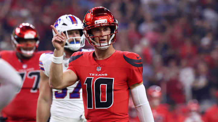 Nov 20, 2025; Houston, Texas, USA; Houston Texans quarterback Davis Mills (10) celebrates after a touchdown against the Buffalo Bills in the second quarter at NRG Stadium. Mandatory Credit: Troy Taormina-Imagn Images