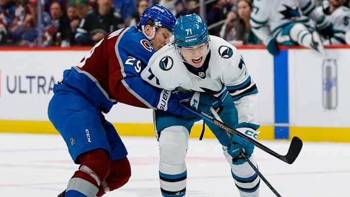 Feb 4, 2026; Denver, Colorado, USA; Colorado Avalanche center Nathan MacKinnon (29) pushes San Jose Sharks center MacKlin Celebrini (71) off the puck in the third period at Ball Arena. Mandatory Credit: Isaiah J. Downing-Imagn Images