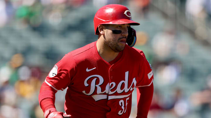 Cincinnati Reds catcher Jose Trevino (35) runs to first base