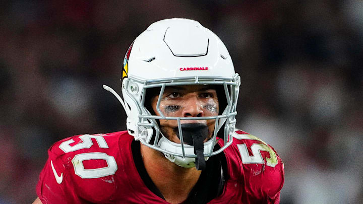 Cardinals linebacker Cody Simon (50) looks over the Raiders' offensive line during a preseason game at State Farm Stadium in Glendale on Aug. 23, 2025.