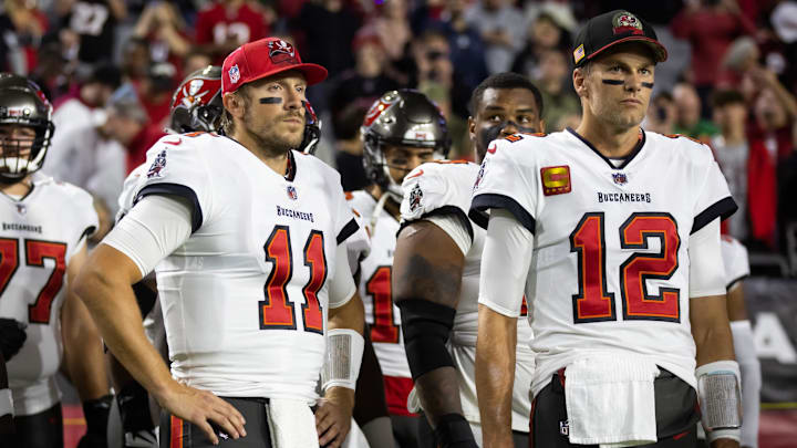 Dec 25, 2022; Glendale, Arizona, USA; Tampa Bay Buccaneers quarterback Blaine Gabbert (11) and Tom Brady (12) against the Arizona Cardinals at State Farm Stadium. Mandatory Credit: Mark J. Rebilas-Imagn Images