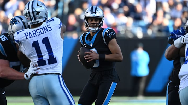 Nov 19, 2023; Charlotte, North Carolina, USA; Carolina Panthers quarterback Bryce Young (9) looks to pass as Dallas Cowboys linebacker Micah Parsons (11) and defensive tackle Mazi Smith (58) defend in the third quarter at Bank of America Stadium. Mandatory Credit: Bob Donnan-Imagn Images Nov 19, 2023; Charlotte, North Carolina, USA; Carolina Panthers quarterback Bryce Young (9) looks to pass as Dallas Cowboys linebacker Micah Parsons (11) and defensive tackle Mazi Smith (58) defend in the third quarter at Bank of America Stadium. Mandatory Credit: Bob Donnan-Imagn Images