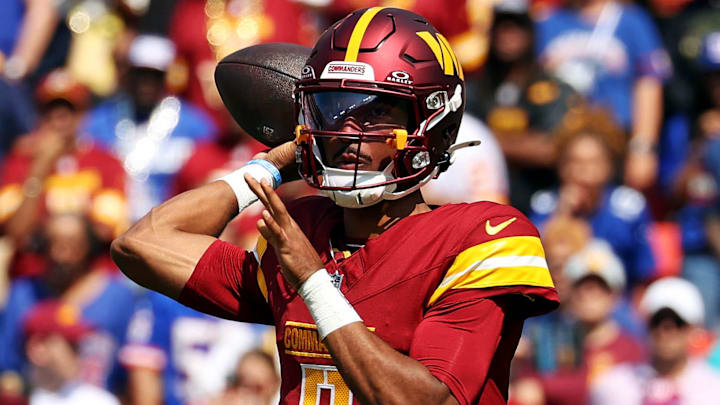 Sep 15, 2024; Landover, Maryland, USA; Washington Commanders quarterback Jayden Daniels (5) throws a pass during the first quarter against the New York Giants at Commanders Field. Mandatory Credit: Peter Casey-Imagn Images