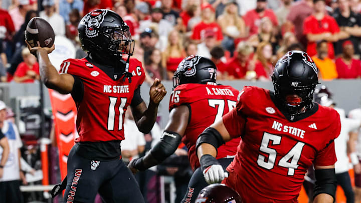 Sep 27, 2025; Raleigh, North Carolina, USA; North Carolina State Wolfpack quarterback CJ Bailey (11) with the ball during the first half of the game against Virginia Tech Hokies at Carter-Finley Stadium. Mandatory Credit: Jaylynn Nash-Imagn Images Sep 27, 2025; Raleigh, North Carolina, USA; North Carolina State Wolfpack quarterback CJ Bailey (11) with the ball during the first half of the game against Virginia Tech Hokies at Carter-Finley Stadium. Mandatory Credit: Jaylynn Nash-Imagn Images