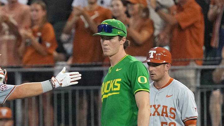 Jun 7, 2026; Austin, TX, USA; Texas Longhorns catcher Carson Tinney (8) reacts ahead of Oregon Ducks first baseman Brayden Jaksa (11) after hitting a single during the second inning of a Super Regional game at UFCU Disch-Falk field in Austin, Texas. Jun 7, 2026; Austin, TX, USA; Texas Longhorns catcher Carson Tinney (8) reacts ahead of Oregon Ducks first baseman Brayden Jaksa (11) after hitting a single during the second inning of a Super Regional game at UFCU Disch-Falk field in Austin, Texas.