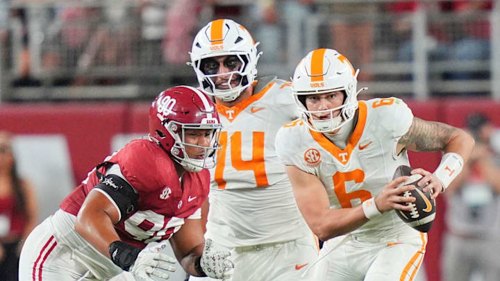Tennessee quarterback Joey Aguilar (6) decides to run the ball during a college football game against Alabama at Bryant-Denny Stadium in Tuscaloosa, Ala., on Oct. 18, 2025.