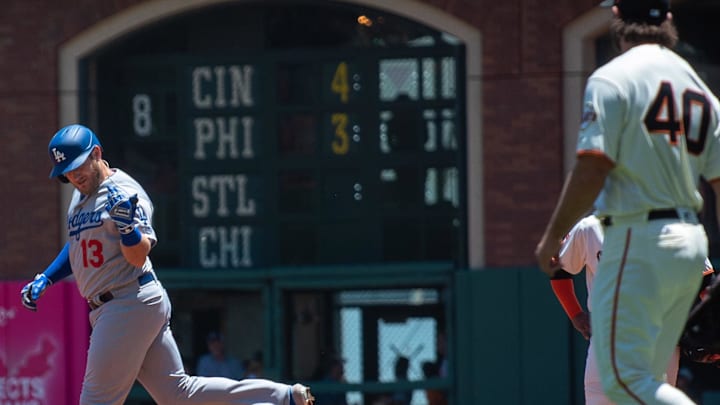 Dodgers slugger Max Muncy (13) celebrates after hitting a home run as San Francisco Giants starting pitcher Madison Bumgarner (40) looks on during the first inning at Oracle Park on June 9, 2019.