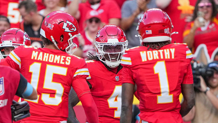 Sep 15, 2024; Kansas City, Missouri, USA; Kansas City Chiefs wide receiver Rashee Rice (4) celebrates after scoring against the Cincinnati Bengals during the game at GEHA Field at Arrowhead Stadium. Mandatory Credit: Denny Medley-Imagn Images