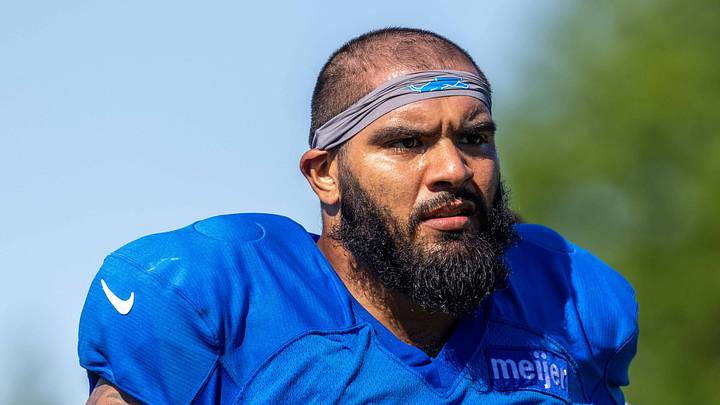 Aug 3, 2026; Allen Park, MI, USA; Detroit Lions offensive lineman Juice Scruggs (70) walks off the field following Detroit Lions training camp. Mandatory Credit: Paul Barnick-Imagn Images