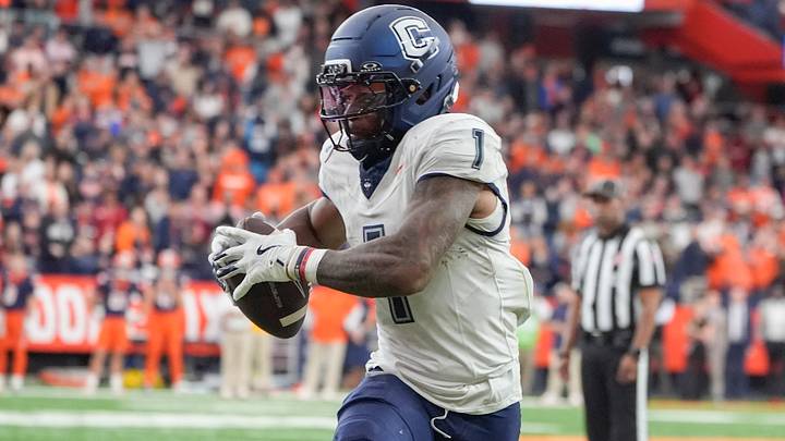 UConn Huskies wide receiver Skyler Bell runs after making a catch against the Syracuse Orange during overtime. UConn Huskies wide receiver Skyler Bell runs after making a catch against the Syracuse Orange during overtime.