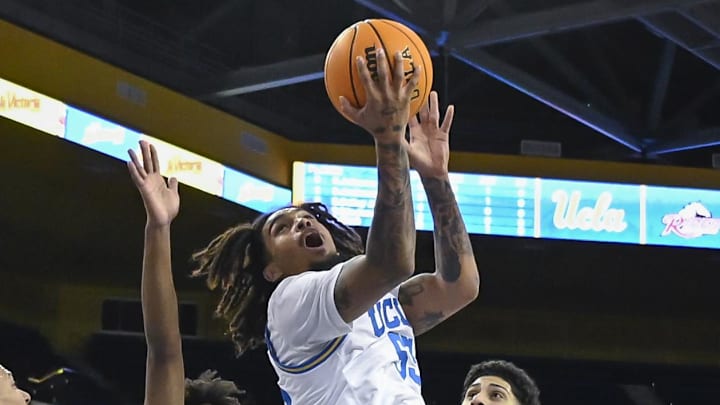 Nov 4, 2024; Los Angeles, California, USA; UCLA Bruins guard Skyy Clark (55) puts up a shot between Rider Broncs guard T.J. Weeks Jr. (35), Jay Alvarez (5), and Tank Byard (8) during the second half at Pauley Pavilion presented by Wescom. Mandatory Credit: Robert Hanashiro-Imagn Images