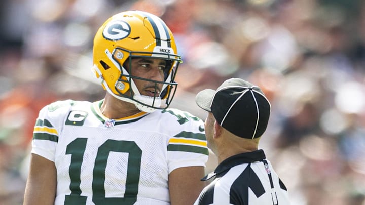 Green Bay Packers quarterback Jordan Love (10) talks with umpire Derek Anderson during the second quarter against the Browns. Green Bay Packers quarterback Jordan Love (10) talks with umpire Derek Anderson during the second quarter against the Browns.