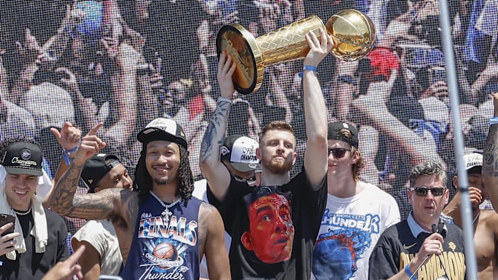 Jun 24, 2025; Oklahoma City, OK, USA; Oklahoma City Thunder center Isaiah Hartenstein holds the Larry O'Brien Championship Trophy during the Oklahoma City Thunder Champions parade. Mandatory Credit: Alonzo Adams-Imagn Images