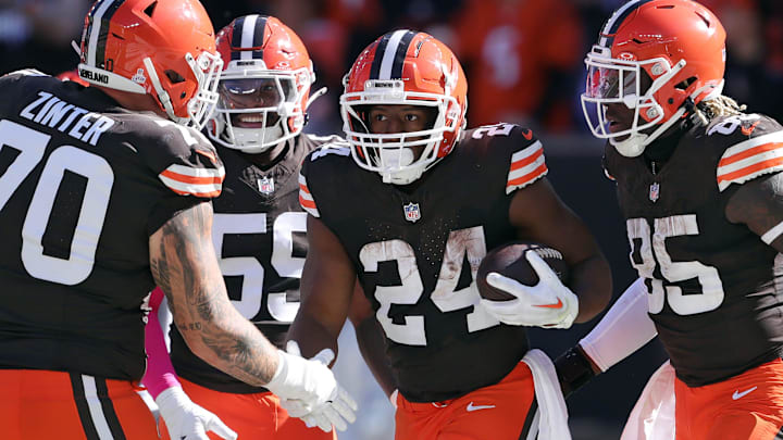 Cleveland Browns running back Nick Chubb (24) celebrates his rushing touchdown with guard Zak Zinter (70) and tight end David Njoku (85) during the first half of an NFL football game against the Cincinnati Bengals at Huntington Bank Field, Sunday, Oct. 20, 2024, in Cleveland, Ohio.