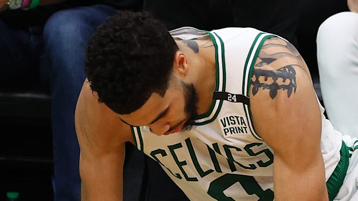 Boston Celtics star Jayson Tatum lifts himself from the hardwood in Boston's Game 4 NBA Finals loss to the Golden State Warriors.
