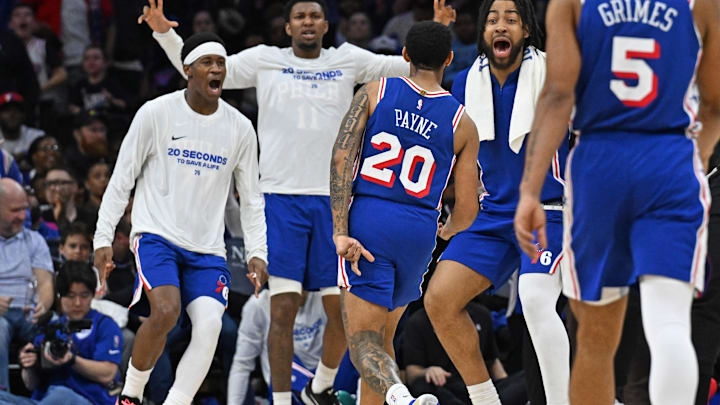 Mar 10, 2026; Philadelphia, Pennsylvania, USA; Philadelphia 76ers guard Cameron Payne (20) celebrates a three point basket with guard Vj Edgecombe (77) and forward Trendon Watford (12) against the Memphis Grizzlies during the second half at Xfinity Mobile Arena. Mandatory Credit: Eric Hartline-Imagn Images