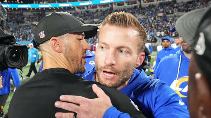Jan 10, 2026; Charlotte, NC, USA; Los Angeles Rams head coach Sean McVay and Carolina Panthers head coach Dave Canales meet after the game in the NFC Wild Card Round game at Bank of America Stadium. Mandatory Credit: Bob Donnan-Imagn Images