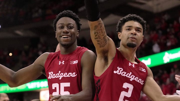 Wisconsin guard John Blackwell (25) and guard Nick Boyd (2) are shown during the waning moment of their game Saturday, December 6, 2025 at the Kohl Center in Madison, Wisconsin. Wisconsin beat Marquette 96-76.