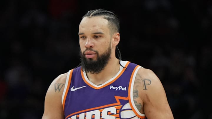 Feb 7, 2026; Phoenix, Arizona, USA; Philadelphia 76ers center Joel Embiid (21) and Phoenix Suns forward Dillon Brooks (3) talk to each other during the second half of an NBA game at Mortgage Matchup Center. Mandatory Credit: Rick Scuteri-Imagn Images