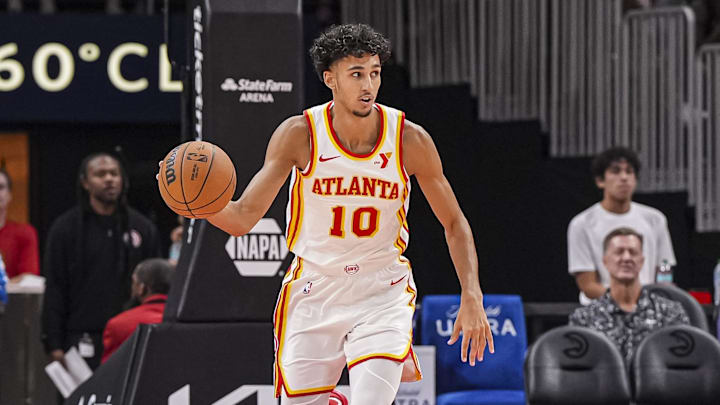 Oct 8, 2024; Atlanta, Georgia, USA; Atlanta Hawks forward Zaccharie Risacher (10) handles the ball against the Indiana Pacers during the first half at State Farm Arena. Mandatory Credit: Dale Zanine-Imagn Images