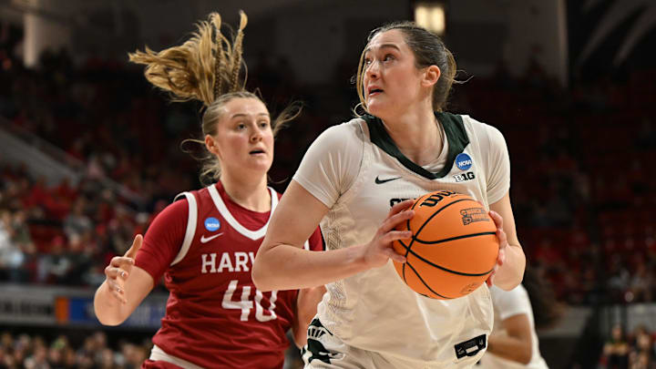 Mar 22, 2025; Raleigh, North Carolina, USA; Michigan State Spartans forward Grace VanSlooten (14) shoots against Harvard Crimson forward Abigail Wright (40) during the first half at James T. Valvano Arena at William Neal Reynolds. Mandatory Credit: William Howard-Imagn Images Mar 22, 2025; Raleigh, North Carolina, USA; Michigan State Spartans forward Grace VanSlooten (14) shoots against Harvard Crimson forward Abigail Wright (40) during the first half at James T. Valvano Arena at William Neal Reynolds. Mandatory Credit: William Howard-Imagn Images