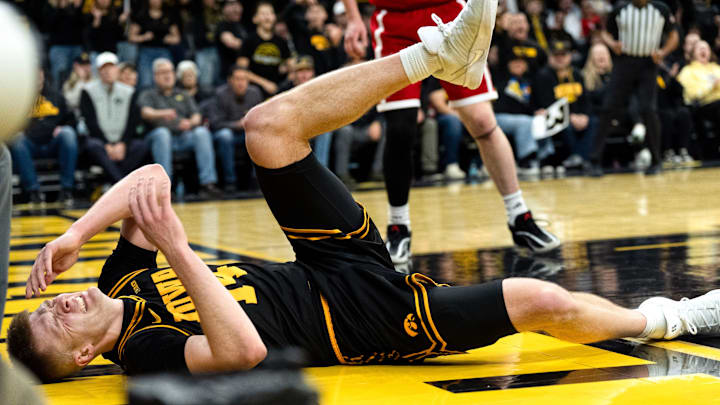 Iowa guard Bennett Stirtz (14) takes a hard fall during a basketball game against the Nebraska Cornhuskers Feb. 17, 2026 at Carver-Hawkeye Arena in Iowa City, Iowa. Iowa guard Bennett Stirtz (14) takes a hard fall during a basketball game against the Nebraska Cornhuskers Feb. 17, 2026 at Carver-Hawkeye Arena in Iowa City, Iowa.