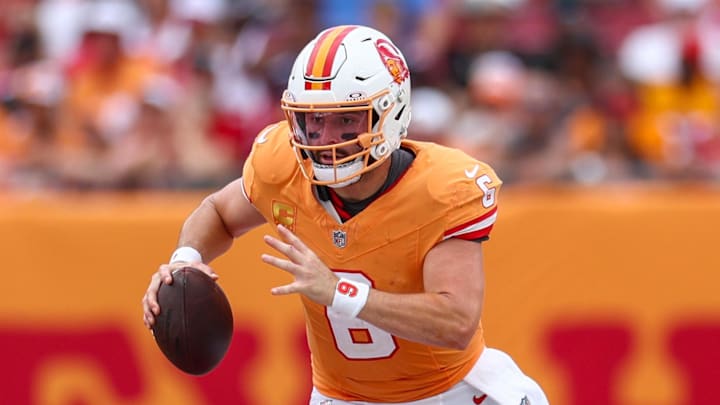 Tampa Bay Buccaneers quarterback Baker Mayfield runs with the ball against the Atlanta Falcons.
