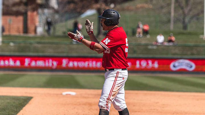 Nebraska designated hitter Tyler Stone celebrates after a hit Sunday against Rutgers.