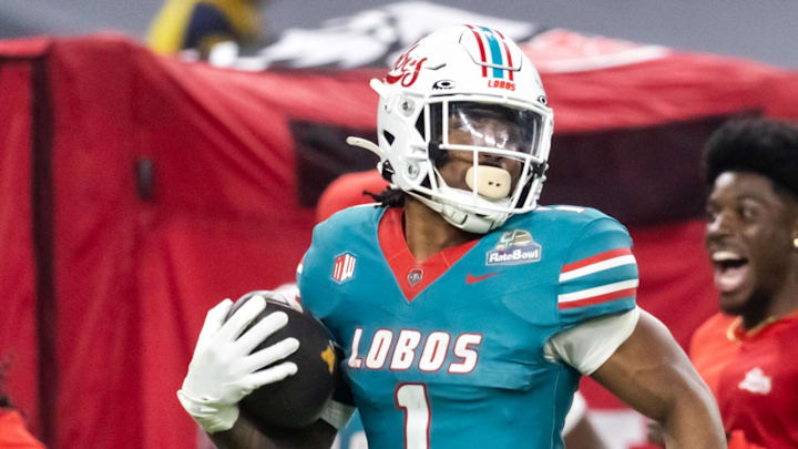 Dec 26, 2025; Phoenix, AZ, USA; New Mexico Lobos running back Damon Bankston (1) returns a kickoff for a 100 yard touchdown against the Minnesota Gophers during the second half of the Rate Bowl at Chase Field.  