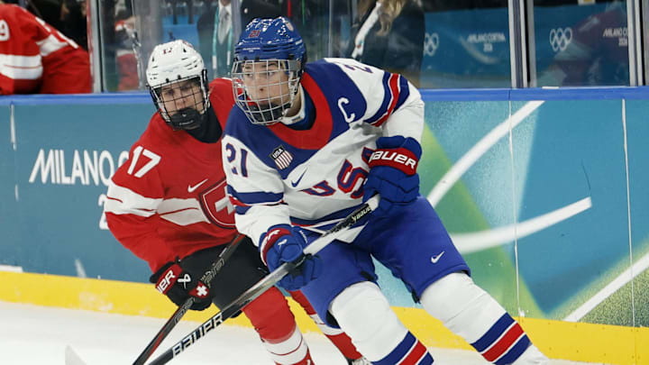 Feb 9, 2026; Milan, Italy;  Hilary Knight of United States in action with Lara Christen of Switzerland in women's ice hockey group A play during the Milano Cortina 2026 Olympic Winter Games at Milano Santagiulia Ice Hockey Arena. Mandatory Credit: Geoff Burke-Imagn Images