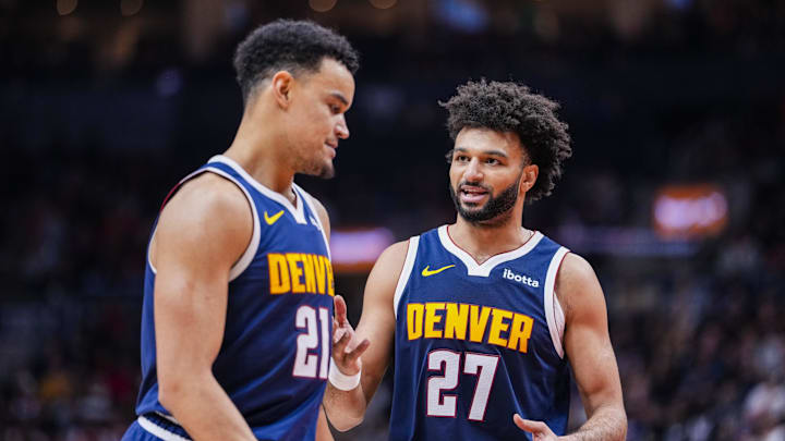 Dec 31, 2025; Toronto, Ontario, CAN; Denver Nuggets guard Jamal Murray (27) stands beside forward Spencer Jones (21) during a break in play against the Toronto Raptors during the second half at Scotiabank Arena.